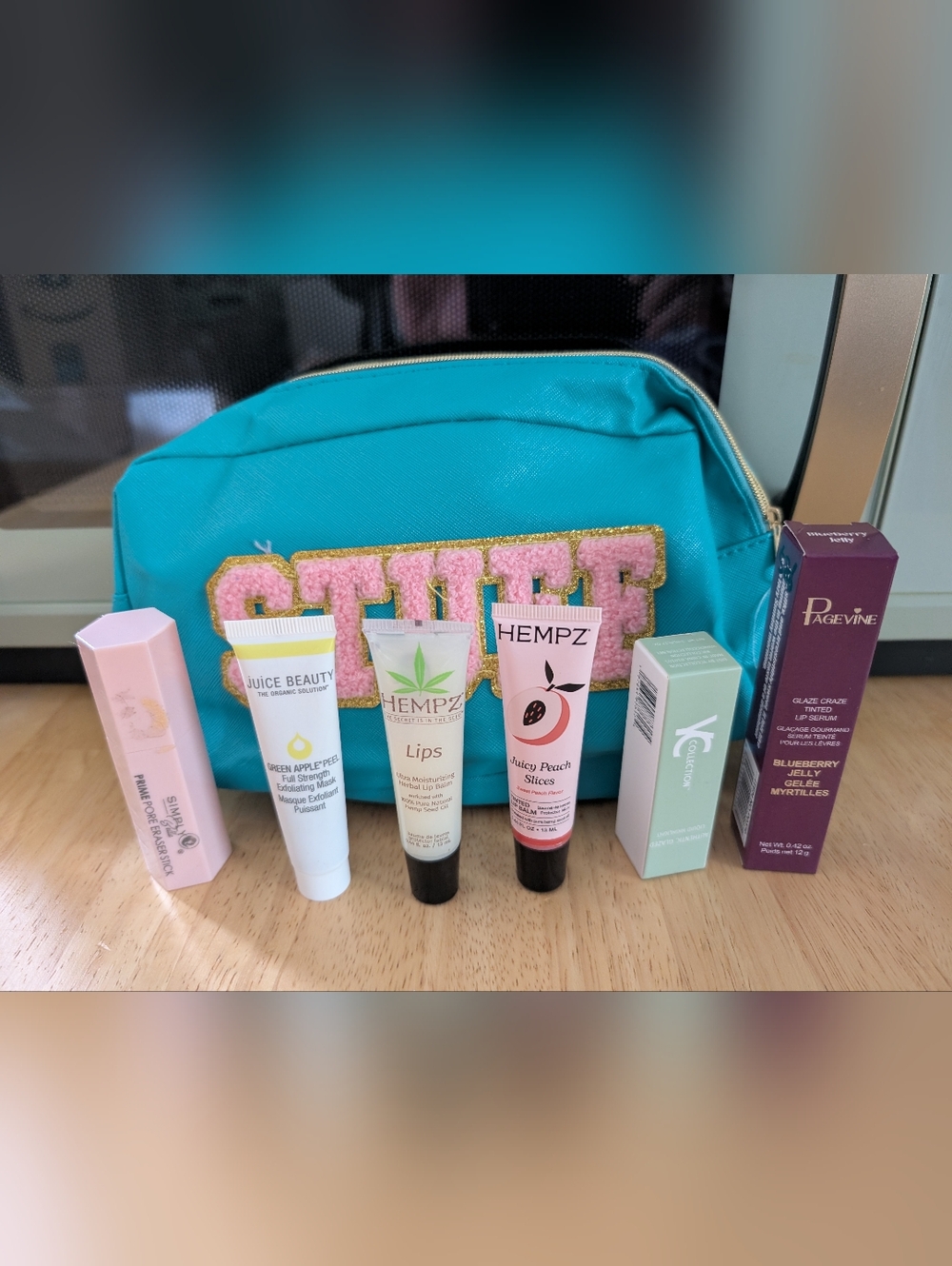 Teal Cosmetic Pouch with Assorted Makeup NWT